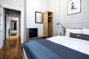 Łóżko lub łóżka w pokoju w obiekcie Bentis Luxury Apartments