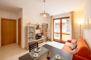 a living room with a couch and a table at Marina Apartment in San Benedetto del Tronto