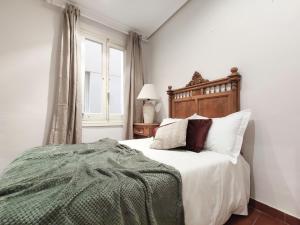 Postel nebo postele na pokoji v ubytování Charmy Apartment Chueca's Square
