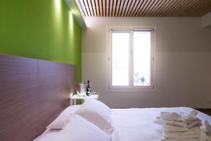 Voodi või voodid majutusasutuse Hotel Marelet toas