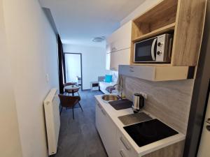 Η κουζίνα ή μικρή κουζίνα στο HP Apartments +61 φωτογραφίες
