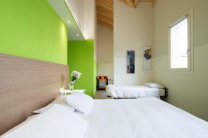 Voodi või voodid majutusasutuse Hotel Marelet toas