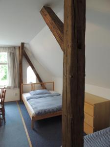 a bedroom with two beds in a attic at Penzion Hají in Janov nad Nisou