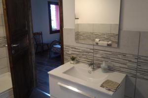 a bathroom with a white sink and a mirror at Corona Bed & Breakfast in Sardara +61 photos