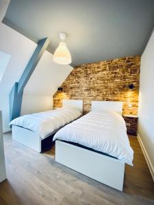 Postel nebo postele na pokoji v ubytování Gîte « Au bord des Embruns »