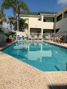 a swimming pool in front of a hotel at Bahama Breeze #4 Sea Dancer Condos in South Padre Island