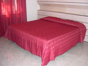 Postel nebo postele na pokoji v ubytování Hotel Bristol