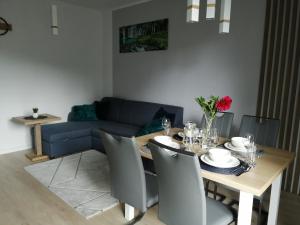 Posedenie v ubytovaní Apartament Zielone Wzgórze