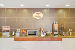 a kitchen with a counter with appliances on it at Royal Inn Airport Salt Lake City in Salt Lake City