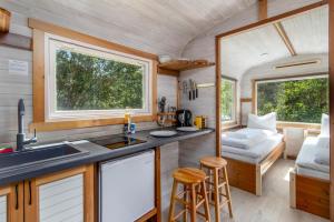 a kitchen and living room in a tiny house at Tiny house with terrace in Flåm