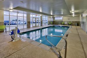 a large swimming pool in a large building at Holiday Inn Roswell by IHG in Roswell