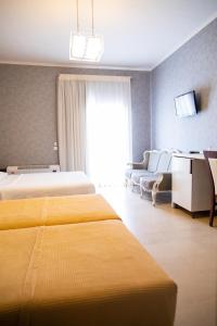 Posteľ alebo postele v izbe v ubytovaní Fanari Hotel
