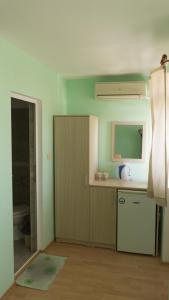 a kitchen with a sink and a counter top at Guest House Gardeli in Tsarevo