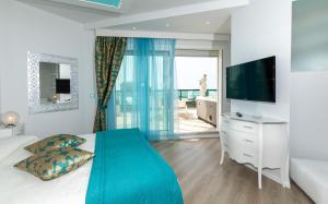 TV a/nebo společenská místnost v ubytování Hotel Carlton