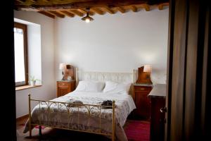 En eller flere senge i et værelse på Casa Campione