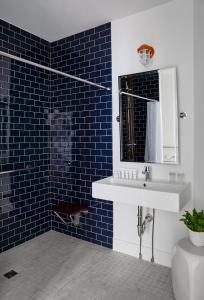 a bathroom with a sink and a mirror at The Attwater in Newport