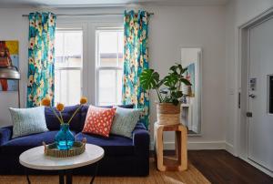 a living room with a blue couch and a table at The Attwater in Newport