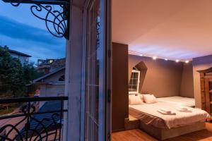 En eller flere senge i et værelse på Luxury Private House in City Center