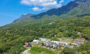 an aerial view of a house in the mountains at Yakushima Cottage Morino Fairy in Yakushima