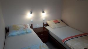 Postel nebo postele na pokoji v ubytování Apartments Svjeta