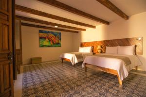 Postel nebo postele na pokoji v ubytování NaNa Vida Hotel Morelia