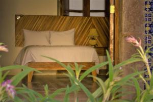 Postel nebo postele na pokoji v ubytování NaNa Vida Hotel Morelia