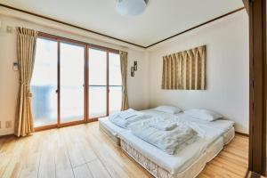 Postel nebo postele na pokoji v ubytování 今日都 Kyoto Guesthouse