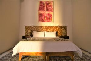 Postel nebo postele na pokoji v ubytování NaNa Vida Hotel Morelia