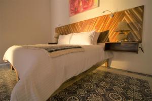 Postel nebo postele na pokoji v ubytování NaNa Vida Hotel Morelia