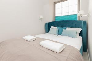 Posteľ alebo postele v izbe v ubytovaní Apartments Tartaczna 2 - Gdansk Old Town by Noclegi Renters