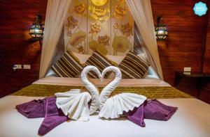 Ein Bett oder Betten in einem Zimmer der Unterkunft Baan Habeebee Resort