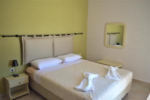 מיטה או מיטות בחדר ב-Hotel Kalimera Apartments