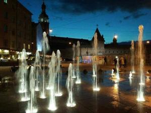a group of water fountains in front of a building at Аpartments in the center (Mytna square) in Lviv +3 photos