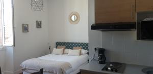a hotel room with a sink and a television at La Villa Esponda in Saint-Jean-Pied-de-Port