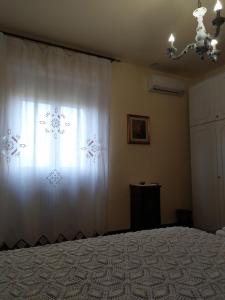 Postel nebo postele na pokoji v ubytování B&B MOLIN DEL TOPO