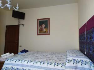 Postel nebo postele na pokoji v ubytování B&B MOLIN DEL TOPO