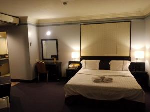 Postel nebo postele na pokoji v ubytování Hotel Deleeton