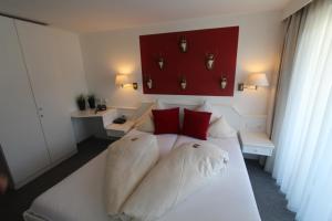 Postel nebo postele na pokoji v ubytování Hotel-Garni Fels