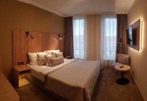 Voodi või voodid majutusasutuse Hotel Clement toas