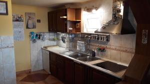 a kitchen with a sink and a stove at Vacation Home Seadream in Varna City