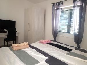 Posteľ alebo postele v izbe v ubytovaní Villa Niva