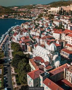 an aerial view of a town next to the water at Apartments Sekoko in Šibenik
