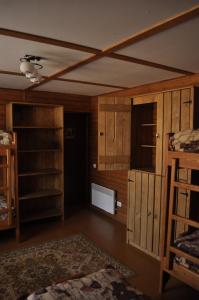 a room with wooden cabinets and a room with a bed at Рада Дараба in Krasnik