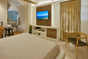 Letto o letti in una camera di Floria Suites