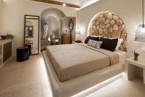 Letto o letti in una camera di Floria Suites