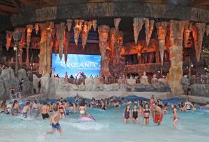 a group of people in a swimming pool at a water park at Ron's Apartment in Colmar +24 photos