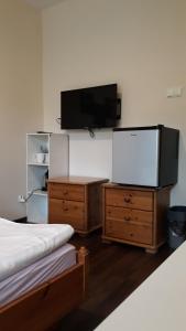 Posteľ alebo postele v izbe v ubytovaní Apartamenty i Pokoje przy Parku