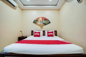 Cama o camas de una habitación en OYO 1027 Patumnak Beach Guesthouse