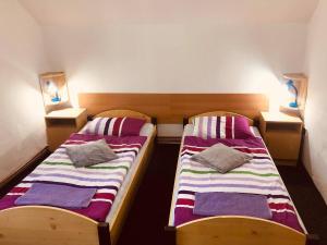 Postel nebo postele na pokoji v ubytování Penzion Ve Dvorku