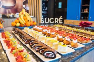 a buffet line with many different types of desserts at ibis Alger Aéroport in Alger